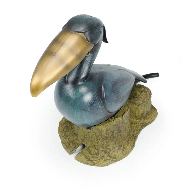 Polyresin toucan pond spitter with realistic brass-look finish